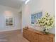 Bright hallway featuring a wooden console table, modern decor, and hardwood flooring at 5434 E Lincoln Dr # 58, Paradise Valley, AZ 85253