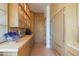 Chef's kitchen with custom wood cabinets, stainless steel appliances, and ample counter space at 5434 E Lincoln Dr # 58, Paradise Valley, AZ 85253