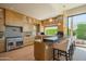 Gourmet kitchen with custom cabinetry, stainless steel appliances, and a breakfast bar at 5434 E Lincoln Dr # 58, Paradise Valley, AZ 85253