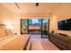Inviting main bedroom featuring a fireplace view, plush bedding, and ample natural light at 5434 E Lincoln Dr # 58, Paradise Valley, AZ 85253