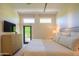 Serene main bedroom with backyard access and a calming color palette at 5434 E Lincoln Dr # 58, Paradise Valley, AZ 85253