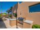 Outdoor kitchen featuring a stainless steel grill, countertop space, and exterior windows at 5434 E Lincoln Dr # 58, Paradise Valley, AZ 85253