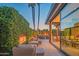 Beautiful outdoor patio featuring a fireplace, comfortable lounge furniture, and seamless indoor-outdoor living at 5434 E Lincoln Dr # 58, Paradise Valley, AZ 85253