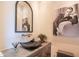 Stylish powder room featuring a unique sink basin, elegant fixtures, and modern design elements at 5434 E Lincoln Dr # 58, Paradise Valley, AZ 85253