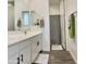 Bright bathroom features a double sink vanity, modern faucet fixtures, and a bathtub with shower at 5549 S Dillon --, Mesa, AZ 85212