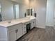 Bathroom featuring white cabinets, double sink, and a vanity at 5549 S Dillon --, Mesa, AZ 85212