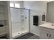 Bathroom featuring white cabinets, glass shower, and shelving unit at 5549 S Dillon --, Mesa, AZ 85212
