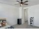 Simple bedroom featuring neutral carpet, a ceiling fan, and open doorway to a walk-in closet at 5549 S Dillon --, Mesa, AZ 85212
