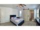 Bedroom featuring barn door, ceiling fan, and carpet flooring at 5549 S Dillon --, Mesa, AZ 85212