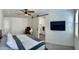 Bright bedroom featuring barn door, ceiling fan, and carpet flooring at 5549 S Dillon --, Mesa, AZ 85212