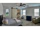 Bedroom featuring barn door, ceiling fan, and closet at 5549 S Dillon --, Mesa, AZ 85212
