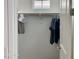 Walk-in closet with hanging rod, neutral color palette, and natural light at 5549 S Dillon --, Mesa, AZ 85212