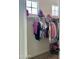 Walk-in closet with hanging rod, neutral color palette, and natural light at 5549 S Dillon --, Mesa, AZ 85212