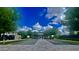 Community center surrounded by green lawns and trees with convenient parking spaces at 5549 S Dillon --, Mesa, AZ 85212