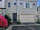 Charming two-story home featuring a two car garage, blue door, and well-maintained landscaping at 5549 S Dillon --, Mesa, AZ 85212