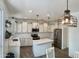 Bright kitchen featuring white cabinets, stainless steel appliances, and stylish pendant lighting at 5549 S Dillon --, Mesa, AZ 85212