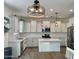 Modern kitchen boasting white cabinets, stainless steel appliances, and a stylish center island at 5549 S Dillon --, Mesa, AZ 85212