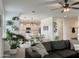 Inviting living room flows into a modern kitchen with white cabinetry and stainless steel appliances at 5549 S Dillon --, Mesa, AZ 85212