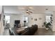 Spacious living room with sectional sofa, large windows, and view of upstairs loft area at 5549 S Dillon --, Mesa, AZ 85212
