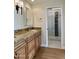 Bathroom featuring granite countertops, cabinetry, and glass shower with tile accents at 5640 E Bell Rd # 1098, Scottsdale, AZ 85254