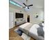 Bedroom featuring vaulted ceiling, ceiling fan, shutters, and access to ensuite bathroom at 5640 E Bell Rd # 1098, Scottsdale, AZ 85254