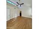 Bedroom featuring vaulted ceiling, ceiling fan, shutters, and access to ensuite bathroom at 5640 E Bell Rd # 1098, Scottsdale, AZ 85254