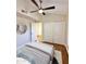 Bright bedroom with vaulted ceiling, wood floors, closet, stylish mirror and neutral decor at 5640 E Bell Rd # 1098, Scottsdale, AZ 85254