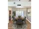 Dining room with a round table, chandelier, shuttered window, and modern accents, ideal for entertaining at 5640 E Bell Rd # 1098, Scottsdale, AZ 85254