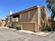 Two-story townhouse featuring private garages and neutral stucco, perfect for a low-maintenance lifestyle at 5640 E Bell Rd # 1098, Scottsdale, AZ 85254