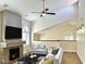 Bright living room boasts a fireplace, ceiling fan, and ample natural light from the arched windows at 5640 E Bell Rd # 1098, Scottsdale, AZ 85254