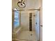 Beautiful walk-in shower with glass enclosure, built-in bench, and decorative tile accent at 5640 E Bell Rd # 1098, Scottsdale, AZ 85254