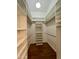 Walk-in closet featuring custom shelving and lighting at 5640 E Bell Rd # 1098, Scottsdale, AZ 85254