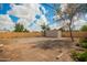 A backyard features dirt, a tree, and a newly installed wood fence at 6231 S 2Nd Ave, Phoenix, AZ 85041