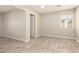 Well lit bedroom featuring wood-look tile flooring and closet at 6231 S 2Nd Ave, Phoenix, AZ 85041