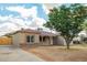 Single story home featuring a driveway with beautiful desert landscaping at 6231 S 2Nd Ave, Phoenix, AZ 85041