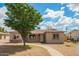 Charming single-story home with a well-manicured front yard and walkway at 6231 S 2Nd Ave, Phoenix, AZ 85041