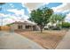 Single story home featuring a driveway with beautiful desert landscaping at 6231 S 2Nd Ave, Phoenix, AZ 85041