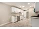Bright kitchen featuring white cabinets, granite countertops, and stainless steel appliances at 6231 S 2Nd Ave, Phoenix, AZ 85041