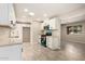 Bright kitchen showcasing white cabinetry, modern appliances, and durable floors at 6231 S 2Nd Ave, Phoenix, AZ 85041