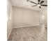 Modern living room showcasing beautiful wood-look tile flooring and ceiling fan at 6231 S 2Nd Ave, Phoenix, AZ 85041