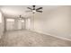 Oversized living room has light walls, tile-look flooring, and laundry access at 6231 S 2Nd Ave, Phoenix, AZ 85041