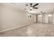 Large living room has light walls, wood-look tile flooring, and ceiling fans at 6231 S 2Nd Ave, Phoenix, AZ 85041