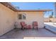 Cozy back patio featuring outdoor seating, decorative string lights, and a private, shaded retreat at 6244 W Clouse Dr, Phoenix, AZ 85033