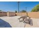 Backyard featuring a picnic table, storage shed, and brick wall, creating a functional and private outdoor space at 6244 W Clouse Dr, Phoenix, AZ 85033