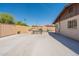 Expansive backyard with a pool, outdoor kitchen, patio furniture, and ample space for entertaining and relaxation at 6244 W Clouse Dr, Phoenix, AZ 85033