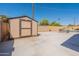 Spacious backyard with shed, block fence, and room for outdoor activities near the pool at 6244 W Clouse Dr, Phoenix, AZ 85033