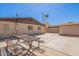 Large backyard featuring a picnic table, hardscape, and partial view of a shed, offering ample space for outdoor activities at 6244 W Clouse Dr, Phoenix, AZ 85033
