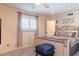 Bright bedroom featuring a ceiling fan, and large window with natural light at 6244 W Clouse Dr, Phoenix, AZ 85033