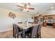 Dining area with seating for six, wood-look floors, and open access to the kitchen at 6244 W Clouse Dr, Phoenix, AZ 85033