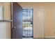 Inviting entryway featuring a secure screen door leading to a bright and airy living space at 6244 W Clouse Dr, Phoenix, AZ 85033